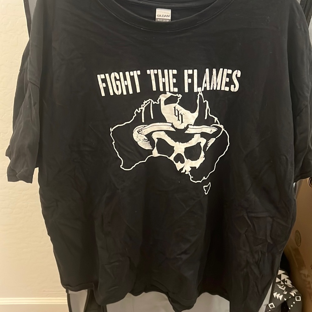 This is a black helmet fire fighter shirt supports the fire fighters 3xl